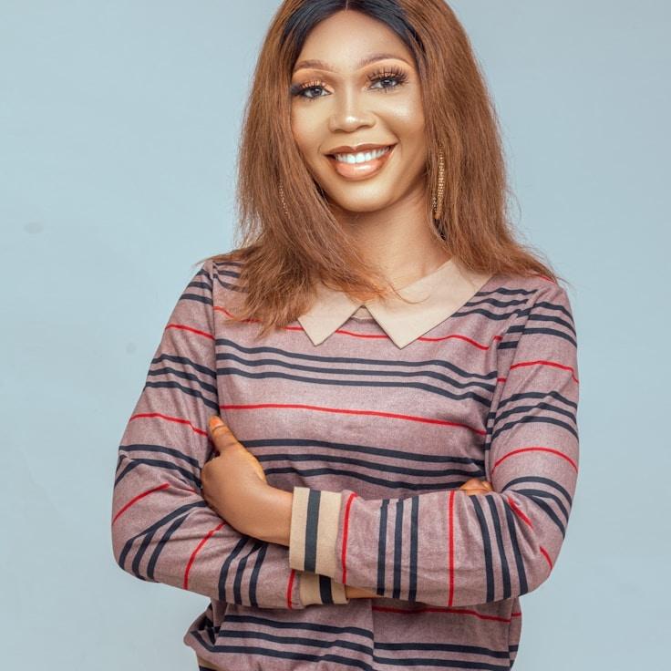 Lena Patel, Lead Design Curator at Plain Ridge Harbor, reviewing corporate floral arrangements